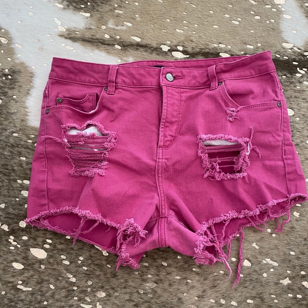 Distressed pink jean shorts